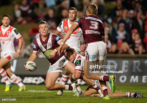 Jake Trbojevic of the Sea Eagles looks to offload during the round 17 NRL match between the Manly Sea Eagles and the St George Illawarra Dragons at...