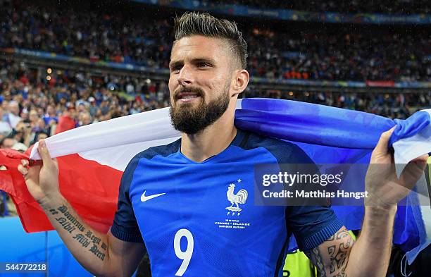 Olivier Giroud of France celebrates his team's 5-2 win after the UEFA EURO 2016 quarter final match between France and Iceland at Stade de France on...