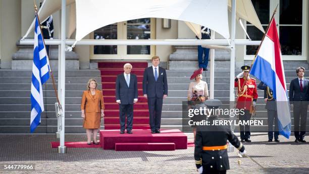 Dutch King Willem-Alexander and Queen Maxima receive the Greek president Prokopis Pavlopoulos and his wife at Palace Noordeinde in The Hague, on July...