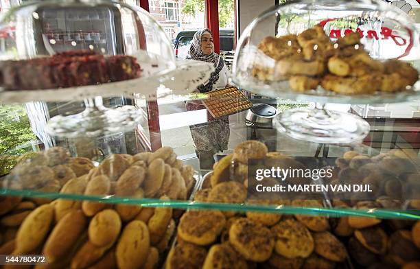 Picture taken in Rotterdam, on July 4 shows Turkish sweets at the backery Antep in preparation for Eid al-Fitr, the celebration which marks the...