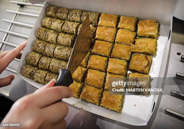 Picture taken in Rotterdam, on July 4 shows Turkish sweets at the backery Antep in preparation for Eid al-Fitr, the celebration which marks the...