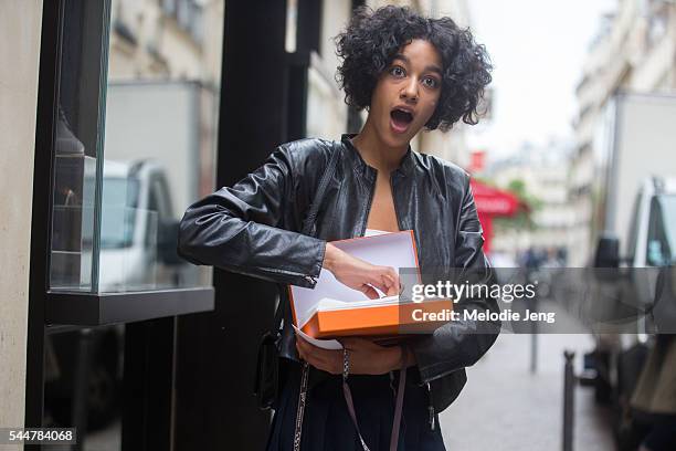 Model Damaris Goddrie holds a Hermes bikini at the Hermes presentation on July 3, 2016 in Paris, France.