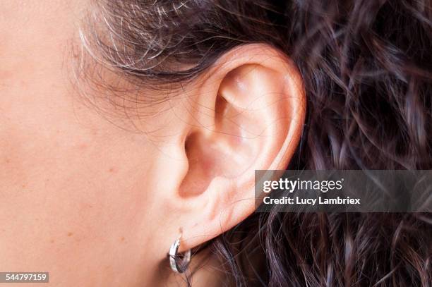 close up of woman's ear - ear close up stock-fotos und bilder