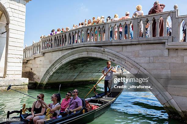 crowd of people on riva degli schiavoni in venice - gondolier stock pictures, royalty-free photos & images