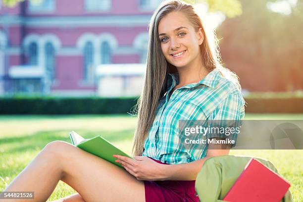 school girl studying in the campus - portrait of school children and female teacher in field stock pictures, royalty-free photos & images