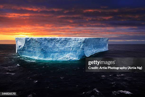 sunset with gigantic tabular iceberg, antarctica - ice shelf stock pictures, royalty-free photos & images