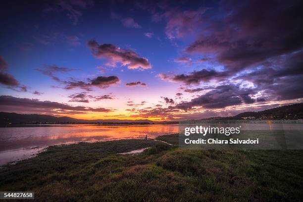 sunset on the knysna lagoon, south africa - knysna stock-fotos und bilder