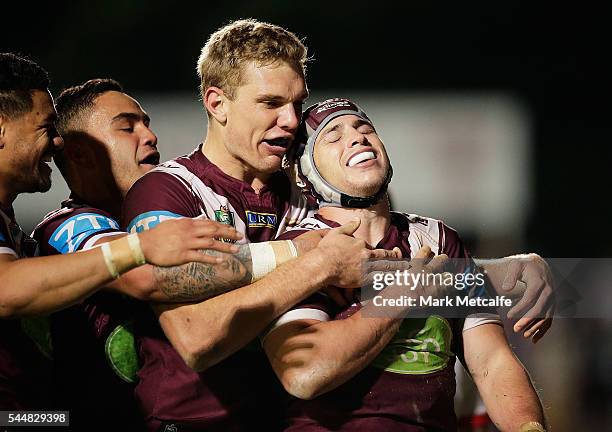 Jamie Buhrer of the Sea Eagles celebrates scoring a try with team mates during the round 17 NRL match between the Manly Sea Eagles and the St George...