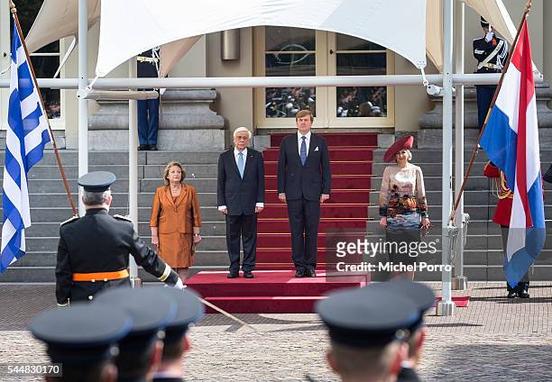 Vlasia Pavlopoulou, Greek President Prokopis Pavlopoulos, King Willem-Alexander and Queen Maxima of The Netherlands listen to the Greek national...