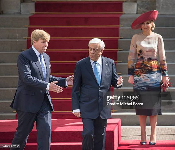 King Willem-Alexander leads Greek President Prokopis Pavlopoulos to review the guard of honour at the Noordeinde Palace at the start of a two-day...