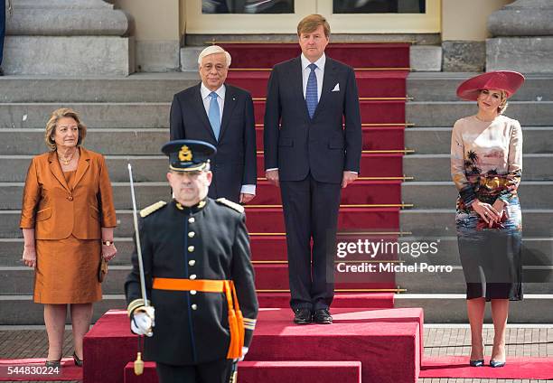 Vlasia Pavlopoulou, Greek President Prokopis Pavlopoulos, King Willem-Alexander and Queen Maxima of The Netherlands listen to the Greek national...