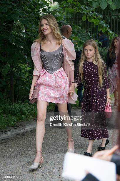 Model Natalia Vodianova and her daughter, wears an Ulyana Sergeenko dress day 1 of Paris Haute Couture Fashion Week Autumn/Winter 2016, on July 3,...