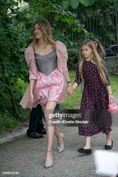Model Natalia Vodianova and her daughter, wears an Ulyana Sergeenko dress day 1 of Paris Haute Couture Fashion Week Autumn/Winter 2016, on July 3,...