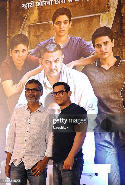 Indian Bollywood actor Aamir Khan attends the poster launch of his upcoming biographical sports drama "Dangal", directed by Nitesh Tiwari , in Mumbai...