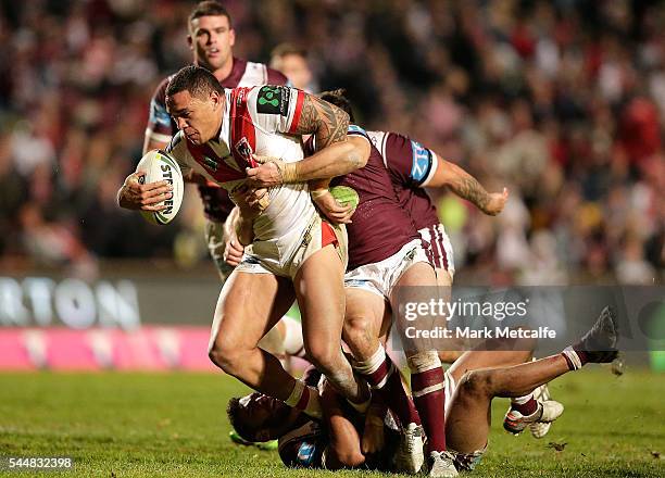 Tyson Frizell of the Dragons is tackled during the round 17 NRL match between the Manly Sea Eagles and the St George Illawarra Dragons at Brookvale...