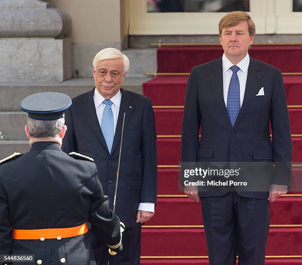 Greek President Prokopis Pavlopoulos and King Willem-Alexander of The Netherlands attend the welcoming ceremony at the Noordeinde Palace at the start...