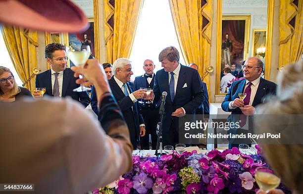 King Willem-Alexander and visiting Greek President Prokopis Pavlopoulos toast during a lunch at the Noordeinde Palace at the start of a two-day visit...
