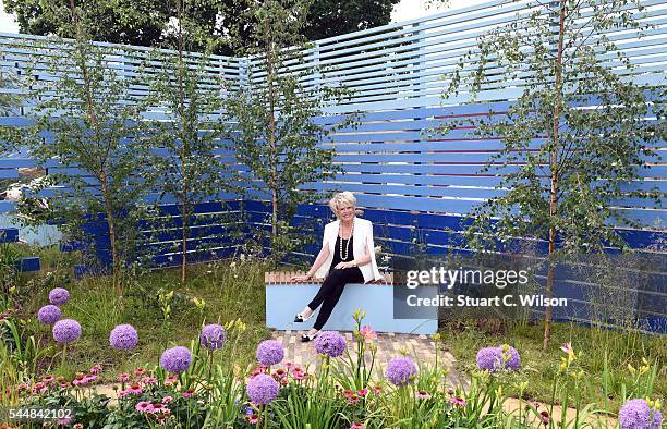 Gloria Hunniford poses in the Cancer Research 'Life Garden' during the launch of the RHS Hampton Court Flower Show at Hampton Court Palace on July 4,...