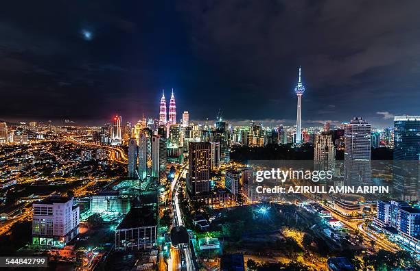 klcc in pink - association of southeast asian nations stock-fotos und bilder