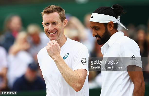Adil Shamasdin of Canada and Jonathan Marray of Great Britain in look on during the Men's Doubles first round match against Pablo Cuevas of Uraguay...