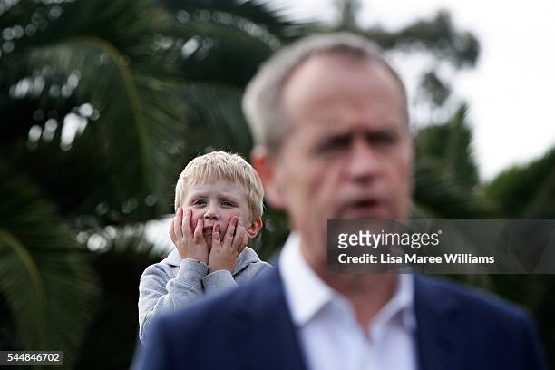 Young boy looks on as Opposition Leader, Australian Labor Party Bill Shorten addresses the media at the Boathouse at Maribyrmong on July 3, 2016 in...