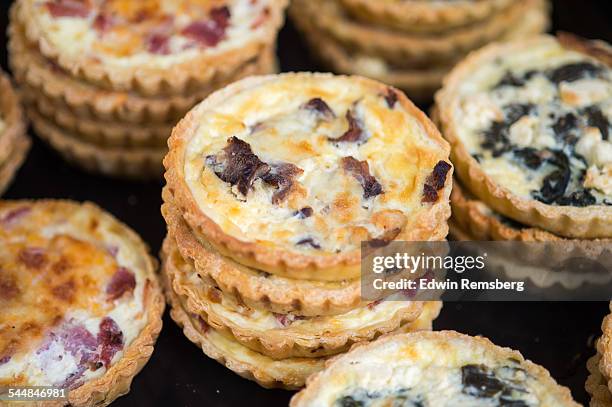 stacks of baby quiche - mini quiche stock pictures, royalty-free photos & images