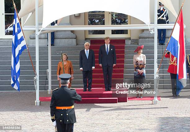 Vlasia Pavlopoulou, Greek President Prokopis Pavlopoulos, King Willem-Alexander and Queen Maxima of The Netherlands listen to the Greek national...