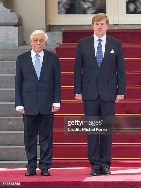 Greek President Prokopis Pavlopoulos and King Willem-Alexander of The Netherlands attend the welcoming ceremony at the Noordeinde Palace at the start...