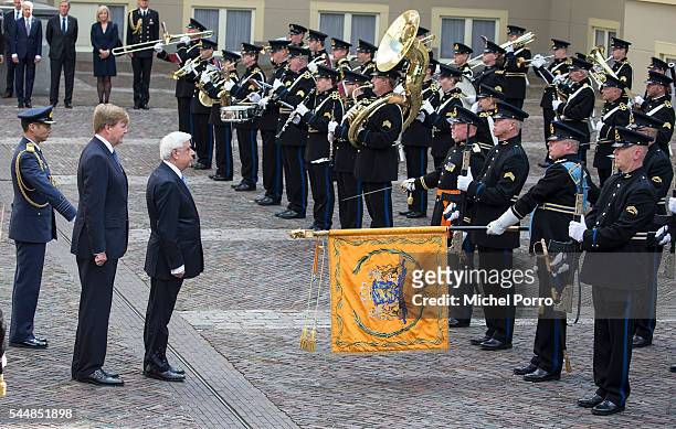 Greek President Prokopis Pavlopoulos and King Willem-Alexander review the guard of honour at the Noordeinde Palace at the start of a two-day visit on...