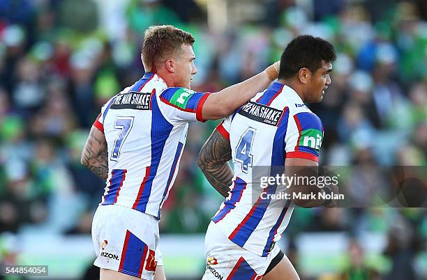 Trent Hodkinson of the Knights celebrates kicking a field goal during the round 17 NRL match between the Canberra Raiders and the Newcastle Knights...