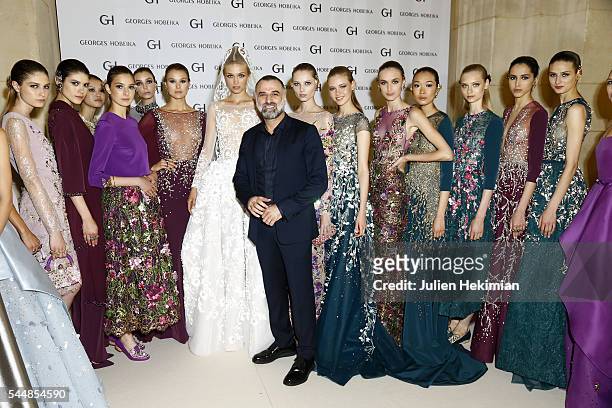 Georges Hobeika poses with models backstage during the Georges Hobeika Haute Couture Fall/Winter 2016-2017 show as part of Paris Fashion Week on at...