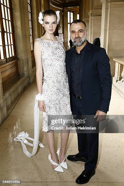 Georges Hobeika poses with a model backstage during the Georges Hobeika Haute Couture Fall/Winter 2016-2017 show as part of Paris Fashion Week on at...