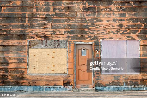 abandoned shop - boarded up stock pictures, royalty-free photos & images