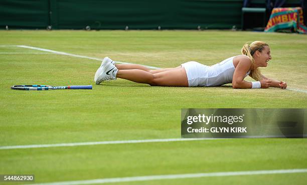 Slovakia's Dominika Cibulkova celebrates after beating Poland's Agnieszka Radwanska during their women's singles fourth round match on the eighth day...