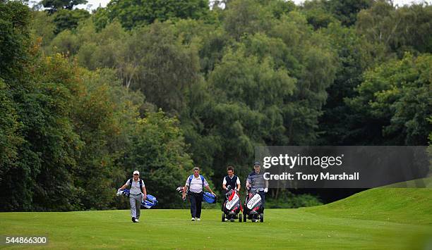 Matt McGuire of Little Lakes Golf Club and Mark Sparrow of Halfpenny Green Golf Club walk down the 8th fairway with Richard Copsey of Enville Golf...