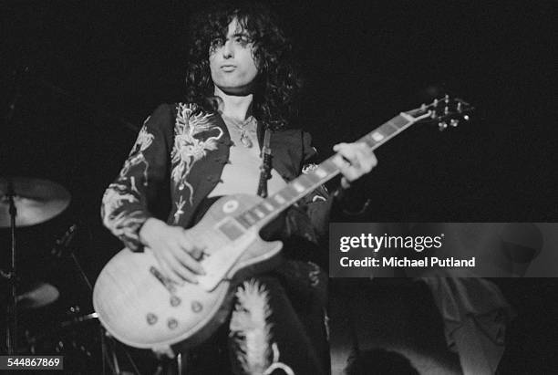 Guitarist Jimmy Page performing with British heavy rock group Led Zeppelin, at Earl's Court, London, May 1975. The band were initially booked to play...