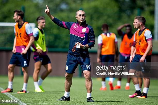 Roberto Di Matteo manager of Aston Villa in action during a Aston Villa training session at the club's training ground at Bodymoor Heath on July 04,...