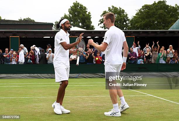 Adil Shamasdin of Canada and Jonathan Marray of Great Britain celebrates victory during the Men's Doubles first round match against Pablo Cuevas of...