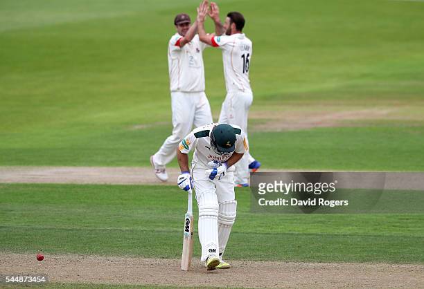 Jordan Clark of Lancashire celebrates after taking the wicket of Michael Lumb during the Specsavers County Championship division one match between...