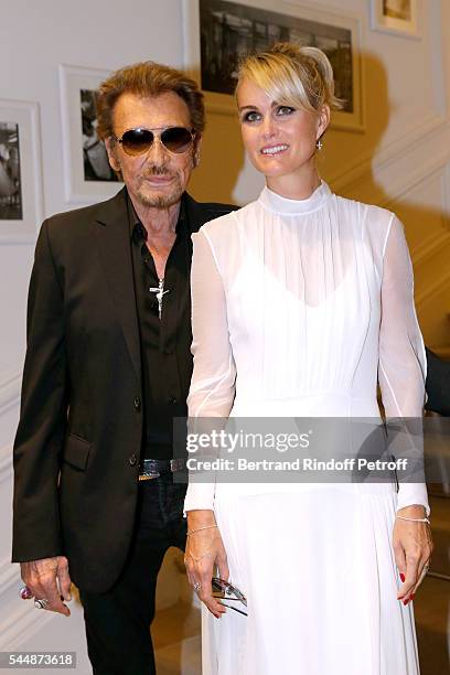 Singer Johnny Hallyday and his wife Laeticia attend the Christian Dior Haute Couture Fall/Winter 2016-2017 show as part of Paris Fashion Week on July...