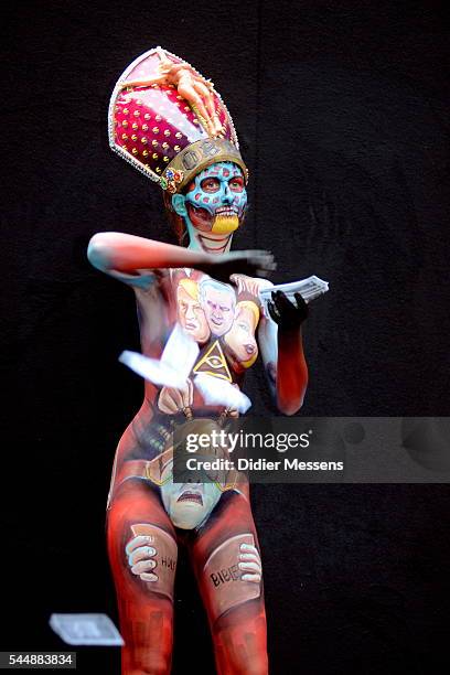 Model poses with her bodypainting designed by bodypainting artist Miguel Angel from Colombia during the World Bodypainting Festival in Poertschach am...
