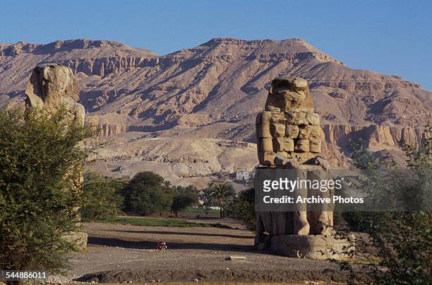 The Colossi of Memnon, two giant statues of Pharaoh Amenhotep III in the Theban Necropolis, Egypt, circa 1965.