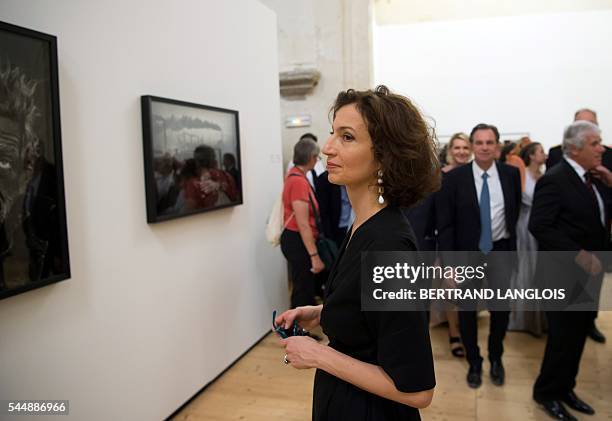 French Culture Minister Audrey Azoulay visits the exhibition "Looking beyond the edge" by Don McCullin as part of the photography festival...