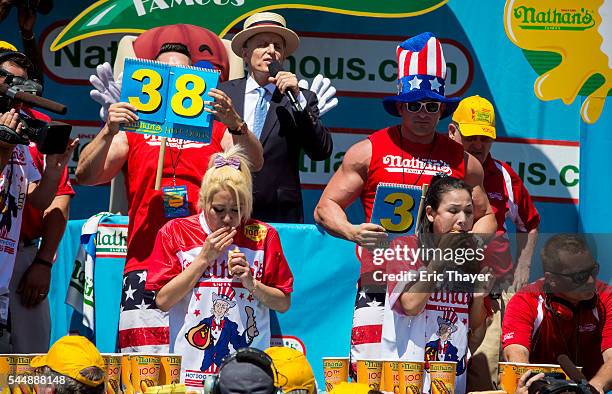 Women's winner Miki Sudo and Sonya Thomas compete in the annual Hot Dog Eating Contest at Coney Island July 4, 2016 in New York City. Joey Chestnut...