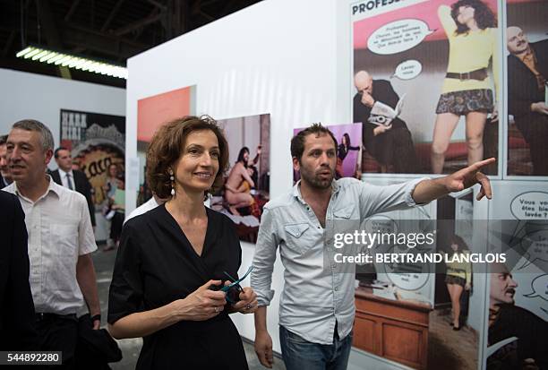 French Culture Minister Audrey Azoulay visits the exhibition "Hara Kiri Photo" as part of the photography festival "Rencontres de la photographie...