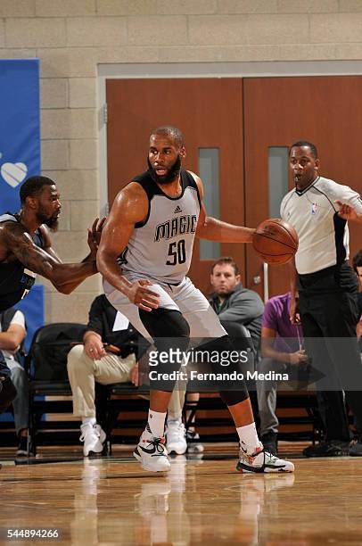 Arinze Onuaku of the Orlando Magic White handles the ball against the Dallas Mavericks during the Orlando Summer League on July 4, 2016 at Amway...