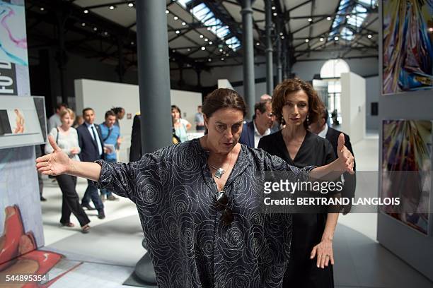 Swiss art patron and founder of the LUMA foundation Maja Hoffmann gestures as she speaks with French Culture Minister Audrey Azoulay during a visit...