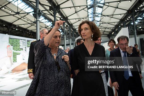 Swiss art patron and founder of the LUMA foundation Maja Hoffmann gestures as she speaks with French Culture Minister Audrey Azoulay during a visit...