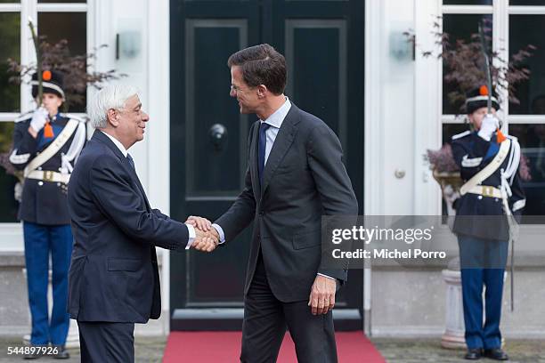 Greek President Prokopis Pavlopoulos is welcomed by Dutch Prime Minister Mark Rutte at the Catshuis during a two-day visit on July 4, 2016 in The...