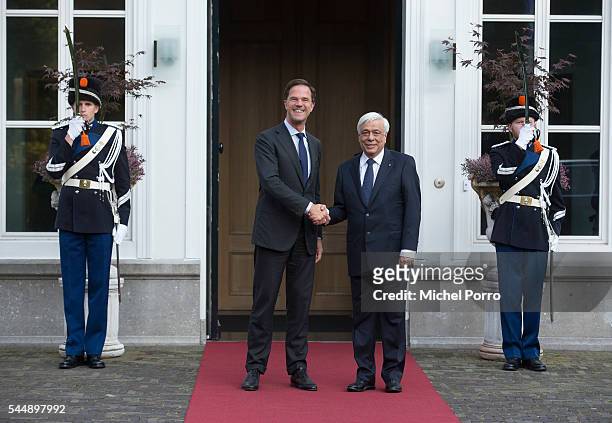 Greek President Prokopis Pavlopoulos is welcomed by Dutch Prime Minister Mark Rutte at the Catshuis during a two-day visit on July 4, 2016 in The...